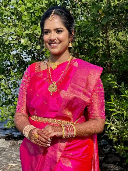 A vision in pink. For this Maharashtrian bride, I created a fresh, glowing look with soft eyes and a statement lip to perfectly balance her vibrant saree and traditional gold jewellery.