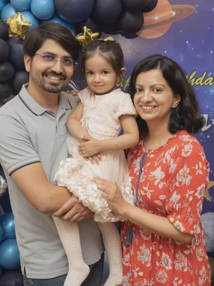 A beautiful family portrait in front of the birthday party backdrop. I make sure to get both posed and candid shots to give you a complete collection of memories.