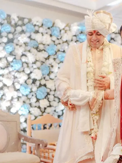 The couple standing together for the rituals, a moment of unity and partnership.