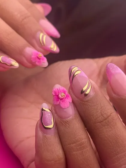 A vibrant and dimensional pink and gold design. This set combines glitter, abstract gold lines, and a beautiful sculpted 3D pink flower for a look that is full of texture and sparkle.