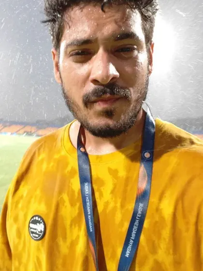 Getting caught in the rain while shooting in Gwalior. As a sports photographer, I am prepared to work in any weather to capture the full story of the day.