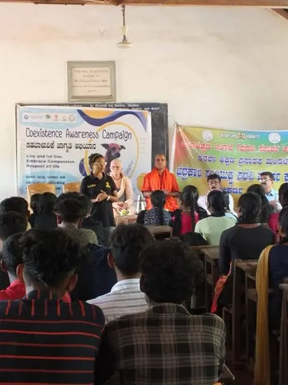 A speaker from our team engages with students during a session in Gokarna. These interactions are vital for answering questions and dispelling myths about community animals.
