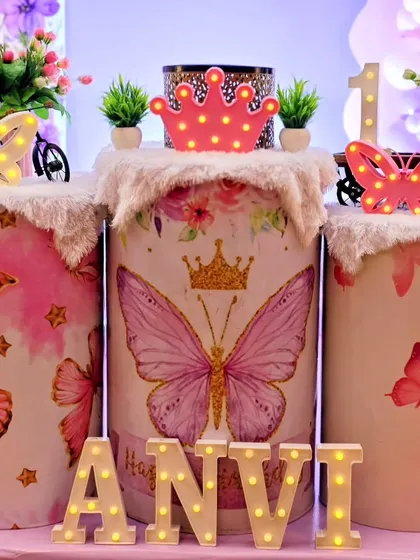 A close-up of the butterfly-themed pedestals with light-up crowns.