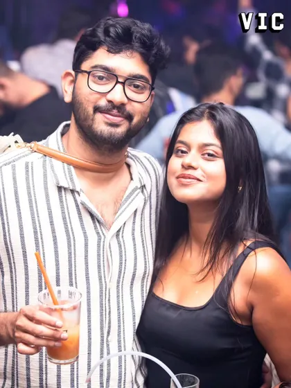 A couple posing for a photo at Sarjapur Social. I love that my gigs become the backdrop for people's happy moments.