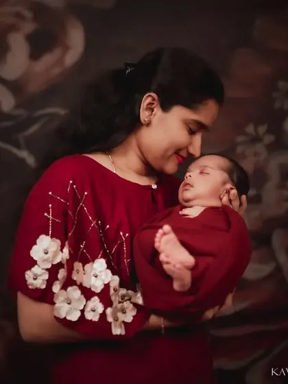 A mother holding her newborn prince. I used soft, warm lighting in the studio to create an intimate and timeless portrait that focuses on their tender connection.
