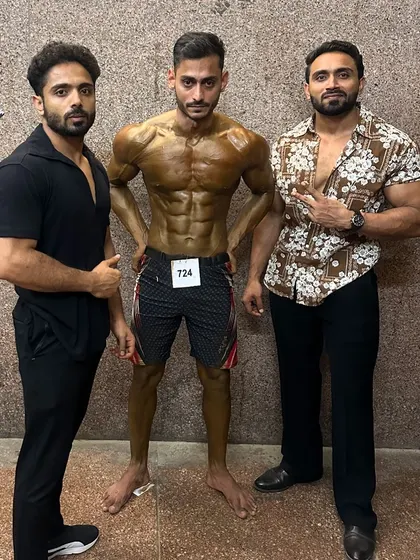 Backstage with another client after his win. The work behind the scenes is what creates a champion.