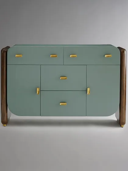 This sleek buffet showcases our mastery of material fusion. A medium sheen lacquer chest in a serene sage green is framed by rich, dark wood sides, all resting on burnished brass plinths. The custom pill-shaped brass pulls add a final touch of refined detail.