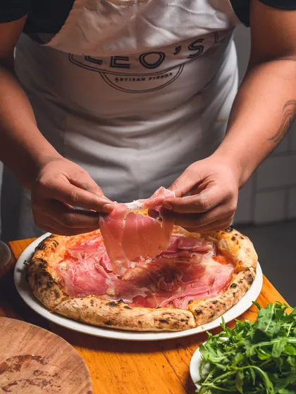 Indulge in the elegance of our Prosciutto di Parma pizza, where premium, aged prosciutto meets a classic Italian base.