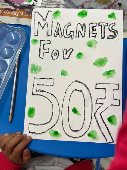 A simple yet effective poster for "Magnets for 50," showing how children used their creativity to promote their products.