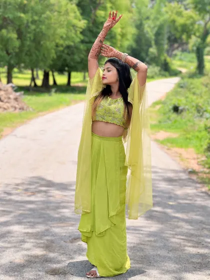 The lime green crop-top set is perfect for outdoor photoshoots, with its color popping against the natural scenery.