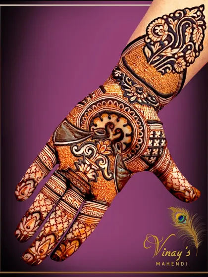 A rich and detailed single-hand design, perfect for a close family member. It features a swan and lotus surrounded by intricate patterns.