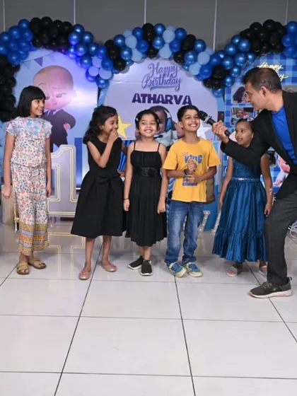 Engaging with the kids on stage during a 'Boss Baby' themed birthday party. I make sure to interact with each child to make them feel special and part of the entertainment.