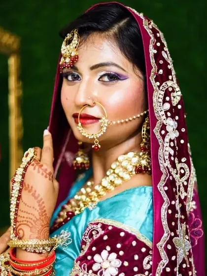A stunning Muslim bridal look with a focus on the eyes and traditional jewelry like the 'nath' (nose ring) and 'passa'.