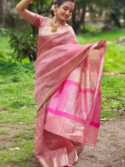 The full drape of the pink linen saree. The custom blouse provides a seamless and elegant foundation for the entire look.
