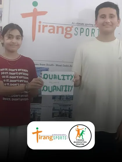 Two of our students proudly display their poster illustrating our "Quality not Quantity" philosophy. It's amazing to see them internalize the core values we teach.