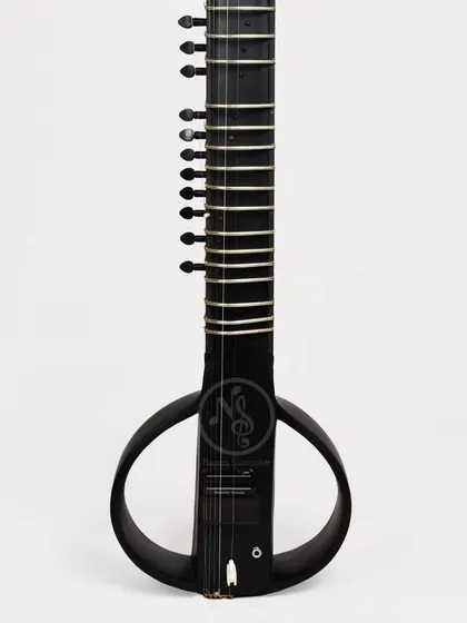 A full-length view of the black electric sitar. It's a modern instrument rooted in classical tradition.