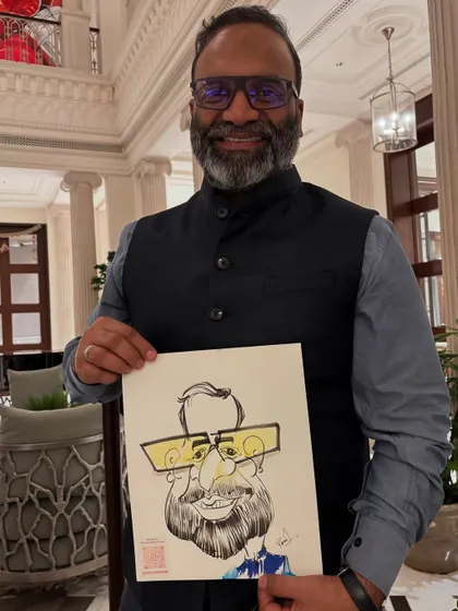 The bright yellow glasses in the caricature add a fun pop of color, matching the guest's cheerful personality.