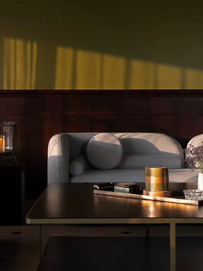 I love using lighting to create a mood. Here, candlelight from the lanterns and the warm glow of the setting sun create a soft, inviting ambiance, perfect for unwinding at the end of the day.