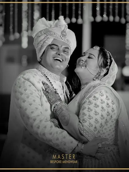 There's nothing more rewarding than seeing a groom beaming on his wedding day. Here, our client Mihir looks joyous and regal in a custom-designed off-white sherwani, perfectly capturing the happiness of the moment.