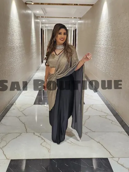 Another beautiful shot of the bride's mami, showcasing the elegant drape and shimmer of her custom saree.