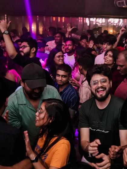 A duplicate of the man laughing on the dance floor. His happiness is infectious.