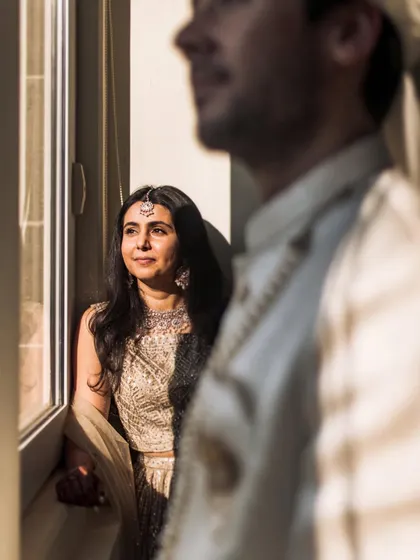 A quiet, contemplative moment by the window. I love capturing these calm, in-between moments amidst the excitement of a wedding day.