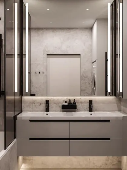A modern bathroom with a large backlit mirror and a floating double vanity. The design is clean, spacious, and perfect for a master ensuite.