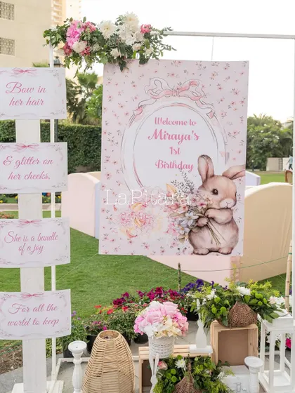 A welcome sign for Miraya's 1st birthday, featuring a cute bunny illustration and a poetic message.
