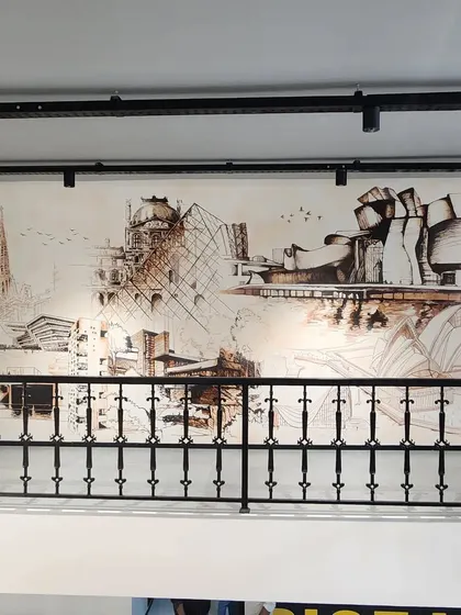 A slightly different angle of the architectural mural, showcasing its prominent placement in the design studio.