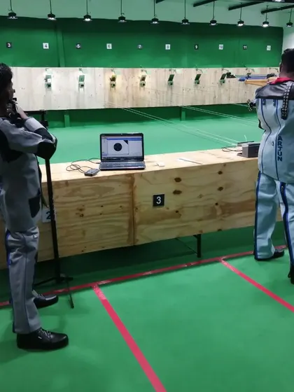 Our students using the SCATT shooting analysis tool during practice. This technology provides instant feedback on every movement, helping to eliminate errors.