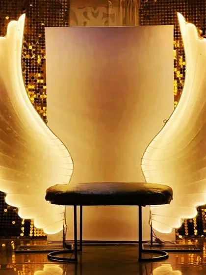 I can definitely get you wings. This photo seat with glowing angel wings is a crowd favorite, creating a heavenly photo opportunity that makes everyone feel like a star.