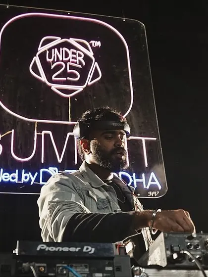 A low-angle shot emphasizing the scale of the stage and the Under 25 Summit branding.