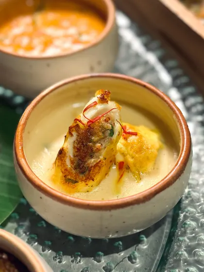 A delicate, stuffed roll in a creamy, saffron-infused sauce, another star of our Navratri Thali.