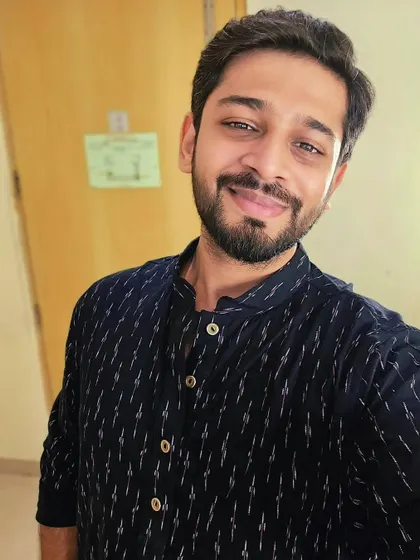 A selfie taken before a concert, wearing a dark patterned kurta. This shows a genuine, ready-to-perform look that is great for social media content or behind-the-scenes promotions.