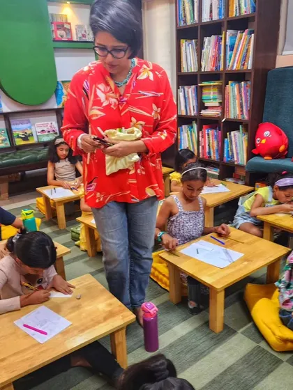 A facilitator guides young artists during our "Doodle Summer Fun" workshop. We create a relaxed environment where kids can learn the basics of doodling without strict rules, just pure creative fun.