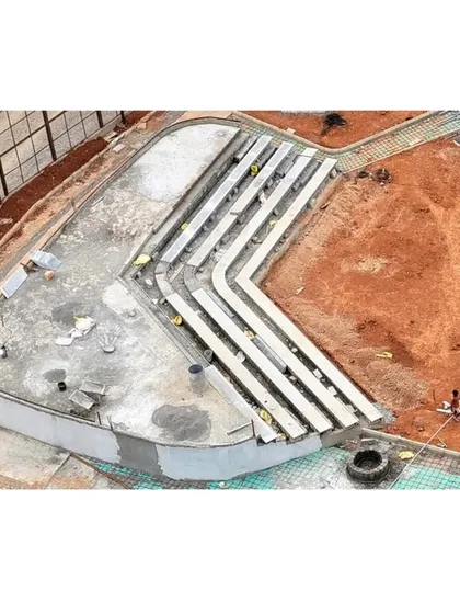 An overhead view of the amphitheater construction. This perspective reveals the geometric precision and structural work that underpins our organic designs.