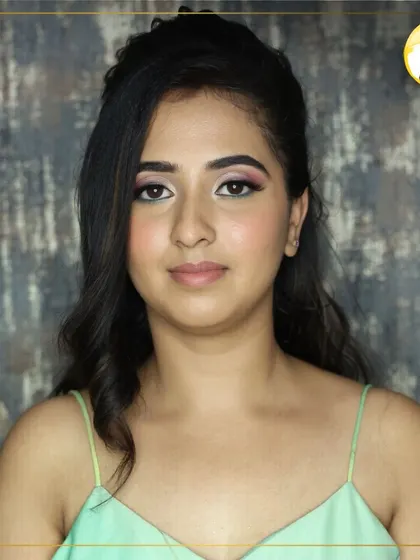 The front-facing view of this soft glam makeup. Notice how the defined brows and clean eyeliner create a polished and elegant appearance, a key focus in my grooming and makeup classes.