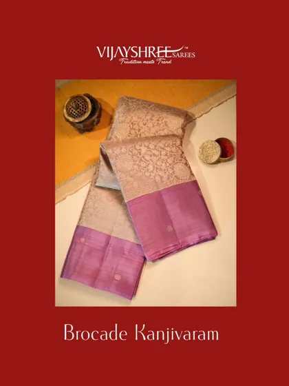 A regal brocade Kanjivaram with a rich lavender border and intricate all-over zari weaving.