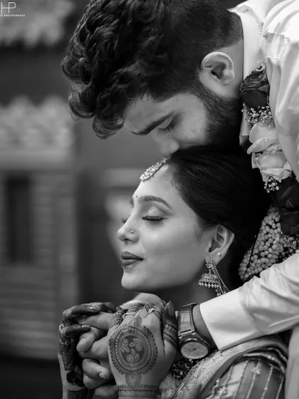 A tender, intimate black and white portrait capturing the deep connection between the couple.