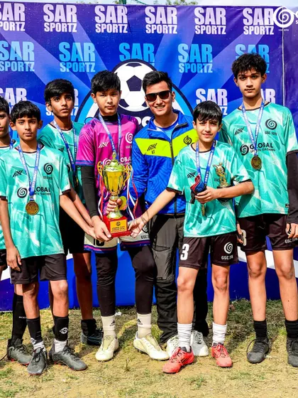 The GSC U13 team posing with their runners-up trophy and medals. A fantastic achievement.