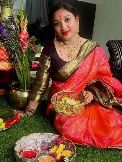A beautiful portrait of our client during the festive celebrations, her vibrant saree reflecting her joyful spirit.
