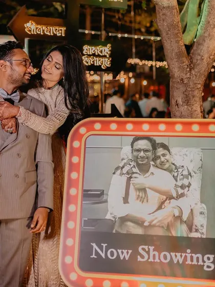 A personalized touch for the Sangeet. We recreated old family photos with the couple, creating a "Now Showing" photo op that was both nostalgic and incredibly sweet.