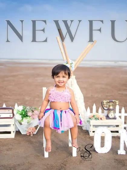 Another beautiful shot from a 'Onewful' beach birthday. The wide-open sky and the simple, rustic props create a stunning backdrop for this happy milestone.