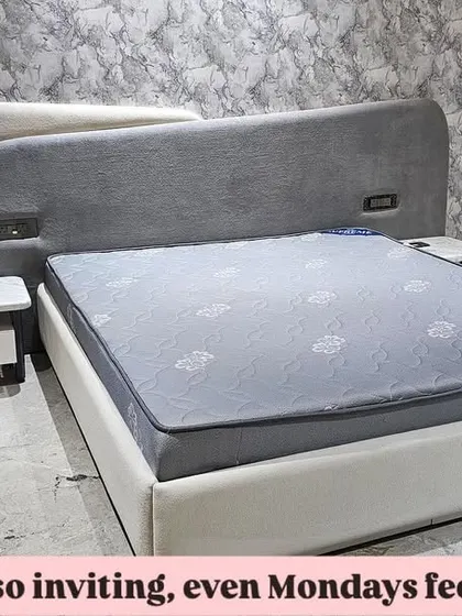 Another view of the modern bed with the asymmetrical headboard, showing how it fits perfectly into the client's space.