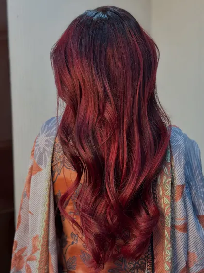 A beautiful, rich cherry red color that's perfect for making a statement. The soft waves add a touch of elegance.