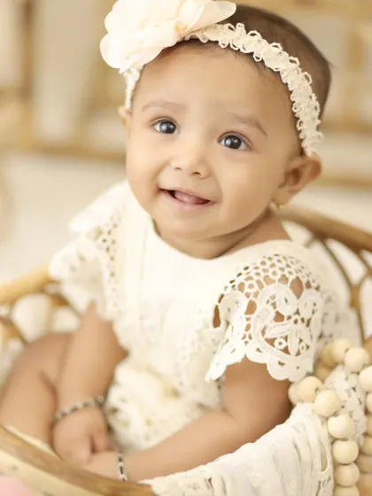 A sweet close up portrait from our boho session. The soft, natural styling allows your baby's innocent beauty to be the main focus of the photograph.