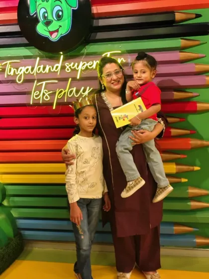 A mother celebrates with her children at Tingaland. We aim to create an environment where parents can relax and enjoy the special moments with their kids.