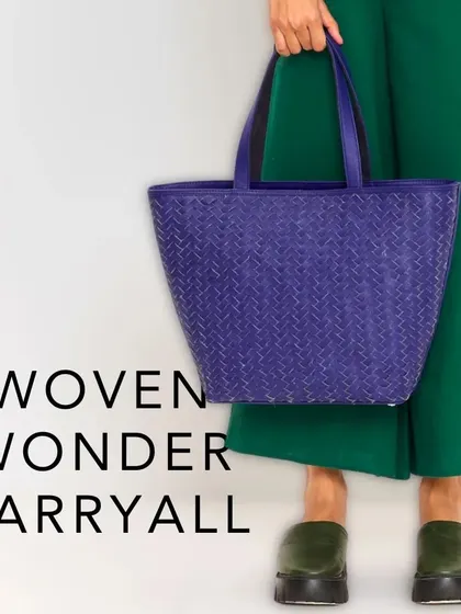 The Woven Wonder Carryall. Meticulously crafted from premium purple leather, its interwoven pattern exudes timeless elegance, ensuring you make a statement wherever you go.