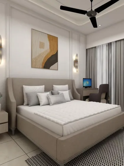 This guest bedroom includes a dedicated workspace, making it a functional multi-purpose room. The wingback bed and elegant wall sconces add a touch of classic style.