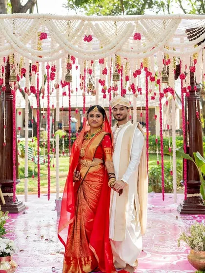 This is the heart of what I do: creating breathtaking traditional wedding mandaps. For this Sati Kalyana, I used classic carved wooden pillars and a canopy of fragrant jasmine and rose garlands to create a truly divine setting for the couple's sacred vows.